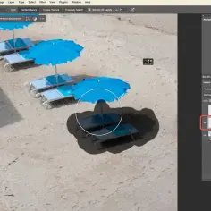 Jak usunąć datę ze zdjęcia? Użyj narzędzia Spot Healing Brush w Photoshopie, aby usunąć niechciane elementy, jak np. datę, z obrazu plaży.